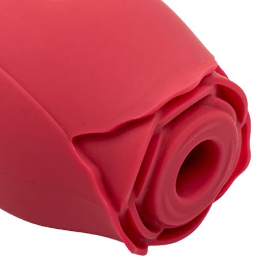 Red rose-shaped clitoral stimulator with silicone suction opening